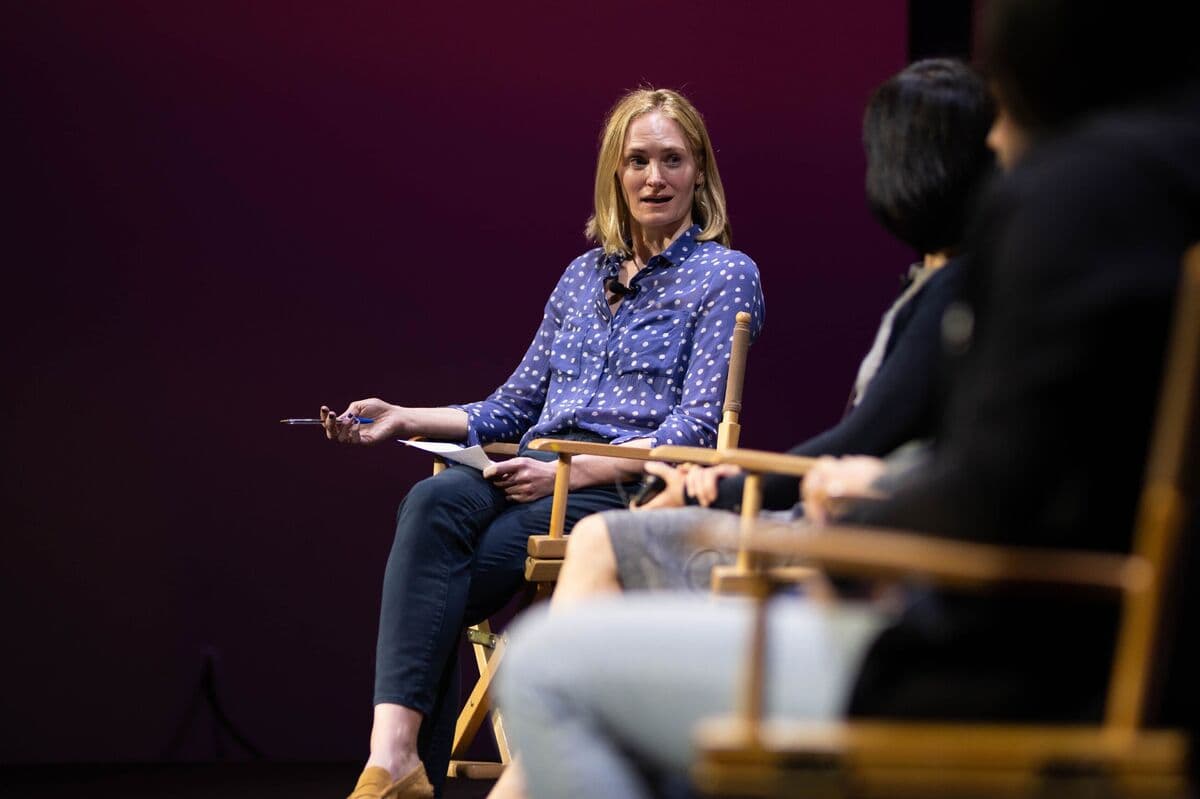 Speakers in conversation onstage at an Alephic event